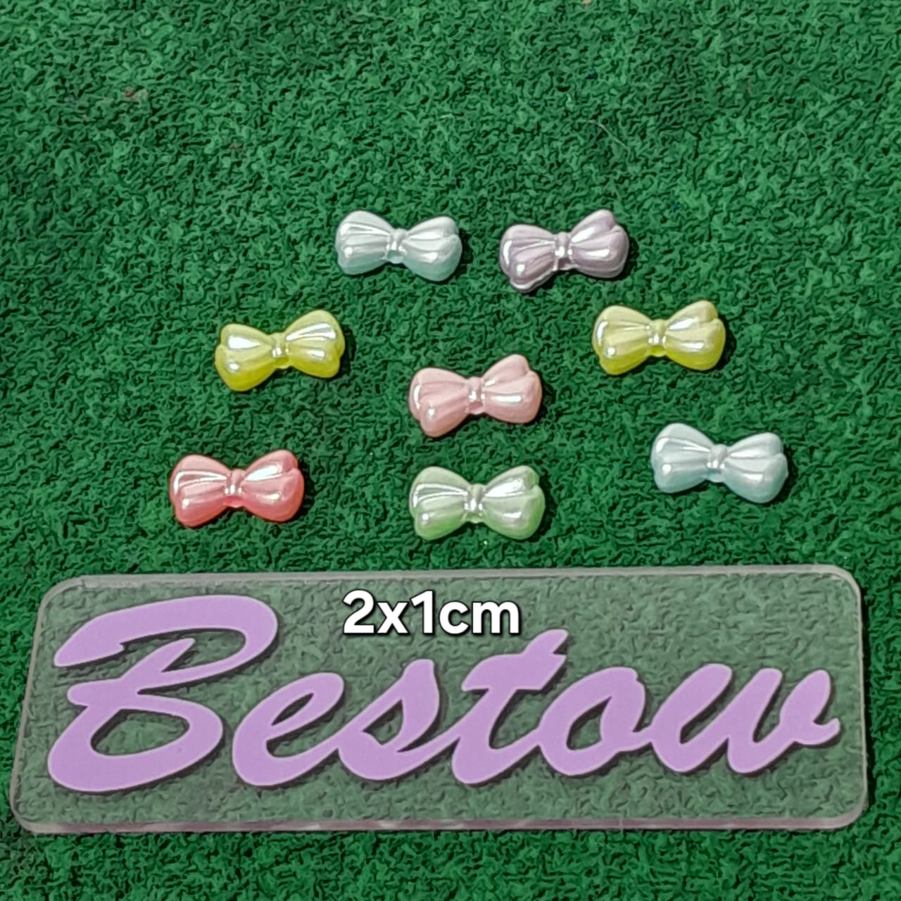 Plastic Multicolor bow beads - Set of 8