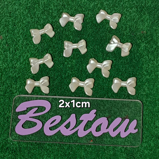 Plastic White bow beads - Set of 10