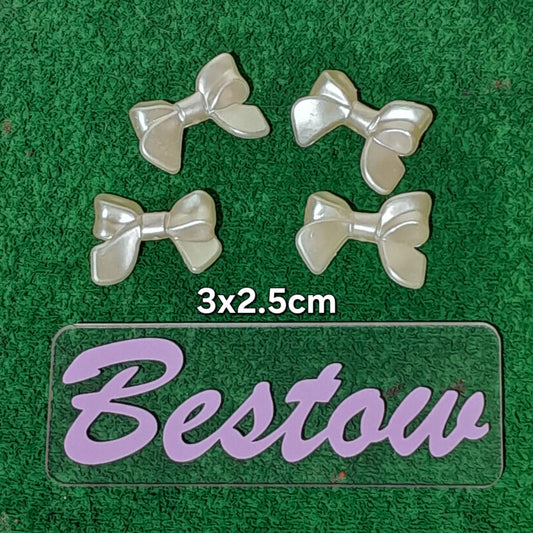 Plastic White bow beads - Set of 4